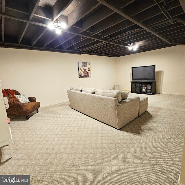 living area featuring carpet floors and baseboards