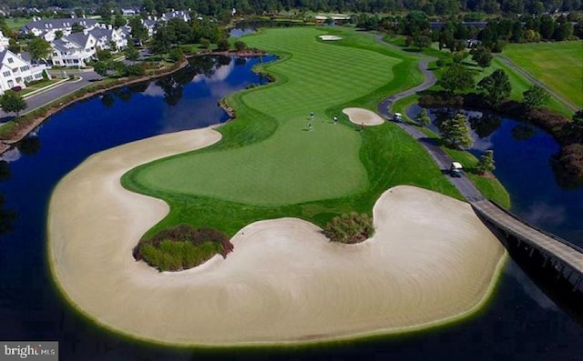 bird's eye view featuring a water view and golf course view