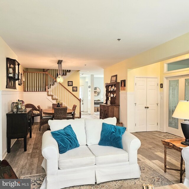 living room with french doors and hardwood / wood-style floors