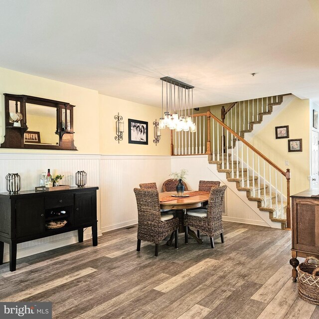 dining room featuring a notable chandelier and wood-type flooring