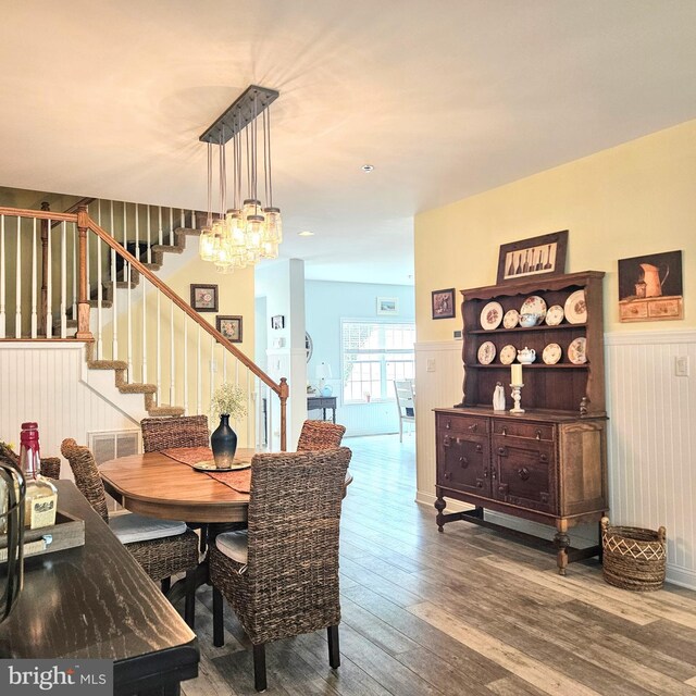 dining room featuring an inviting chandelier and wood-type flooring