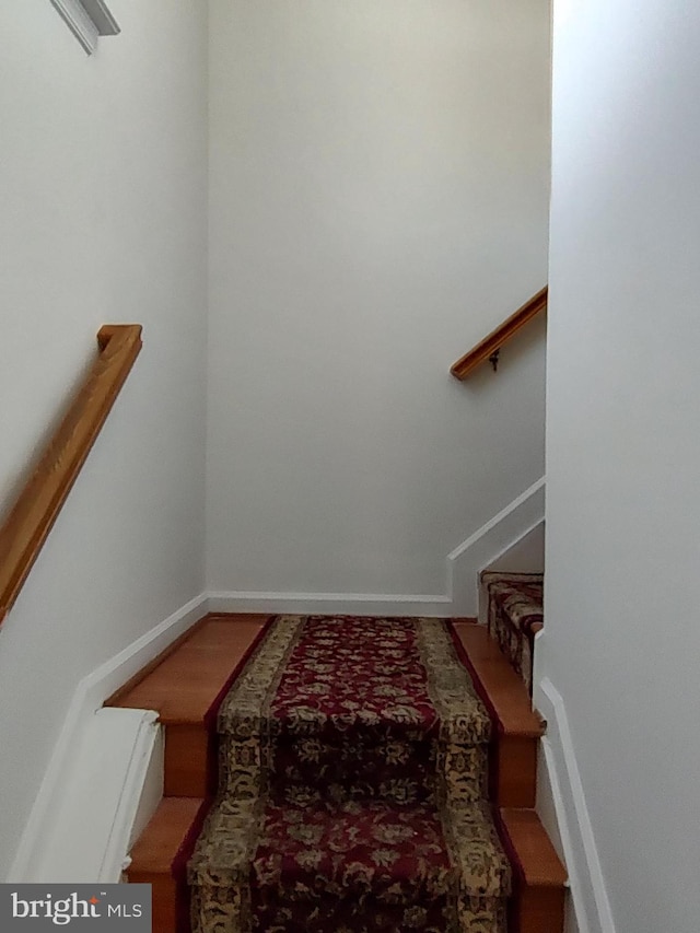 stairs featuring baseboards