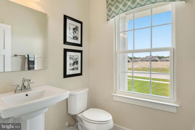 bathroom with sink and toilet