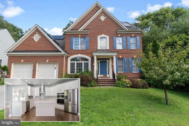 view of front of house with a garage, solar panels, exterior kitchen, and a front lawn