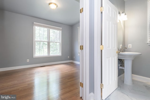 bathroom featuring hardwood / wood-style floors and sink