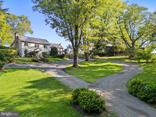 view of property's community with a yard