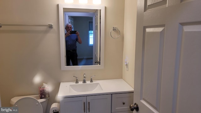 bathroom with vanity and toilet