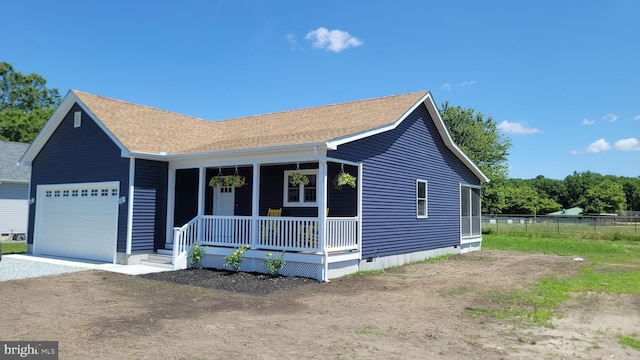 view of front facade with covered porch and a garage