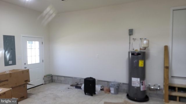 interior space with electric panel and electric water heater