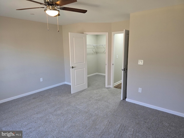 unfurnished bedroom with ceiling fan, a closet, and carpet