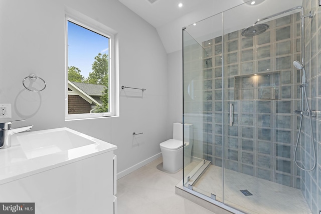 bathroom with vanity, toilet, walk in shower, and vaulted ceiling