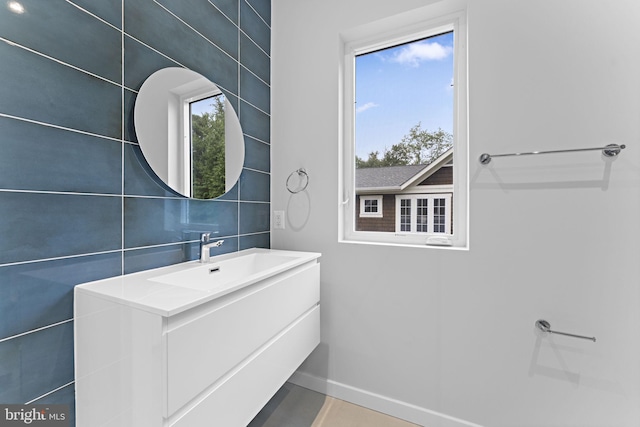 bathroom featuring a wealth of natural light and vanity