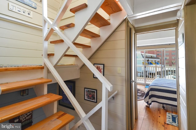 stairs with wood-type flooring