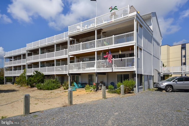 view of building exterior with gravel driveway