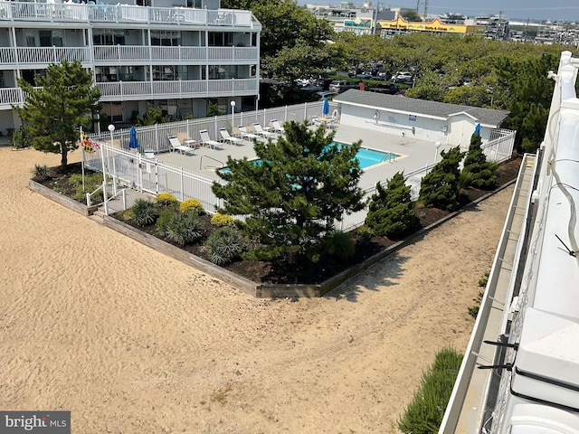 view of swimming pool with fence