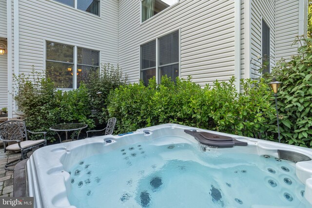 view of pool featuring a hot tub