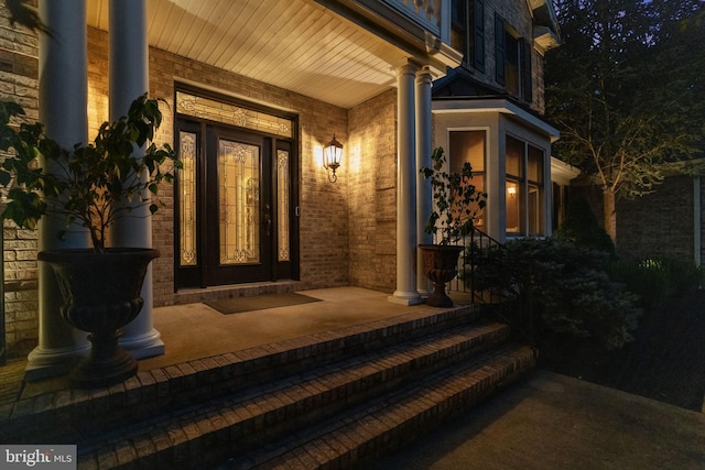 property entrance with covered porch