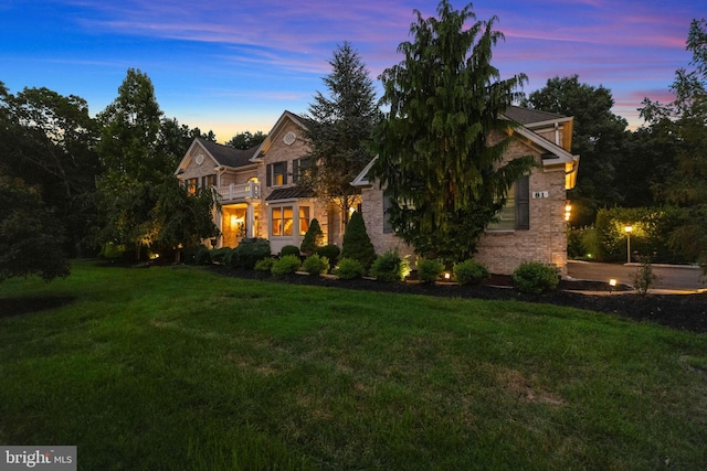 view of front of home with a yard