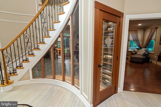 stairs with hardwood / wood-style flooring