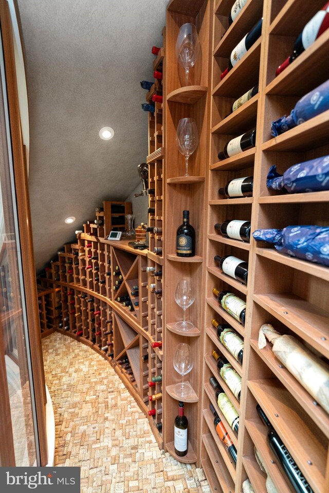 wine area with a textured ceiling