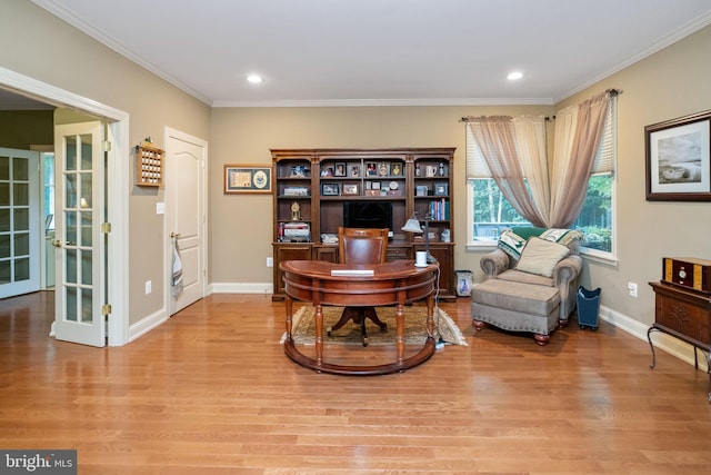 sitting room with light wood-type flooring, french doors, and ornamental molding