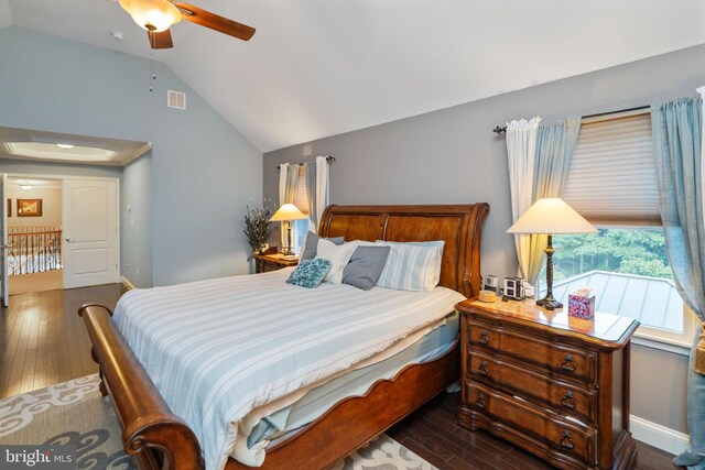 bedroom featuring ceiling fan, vaulted ceiling, and dark wood-type flooring