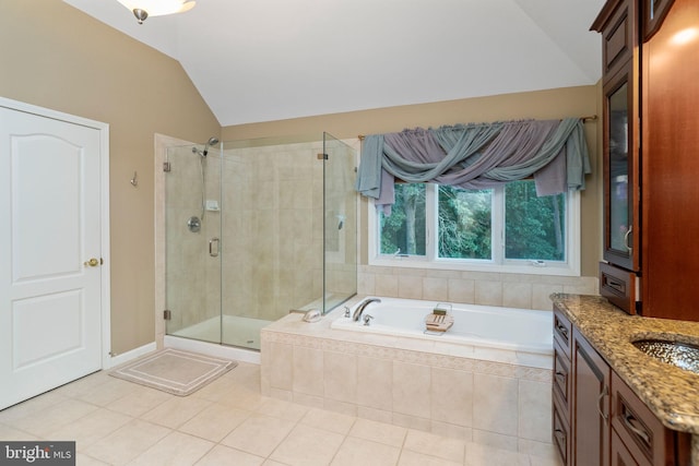 bathroom featuring tile patterned floors, shower with separate bathtub, vanity, and lofted ceiling