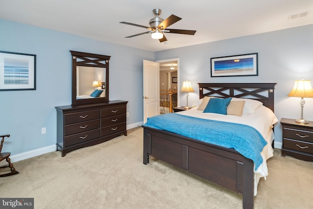 bedroom with ceiling fan and light carpet