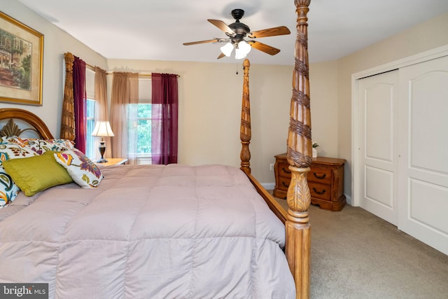 bedroom featuring ceiling fan, a closet, and carpet flooring