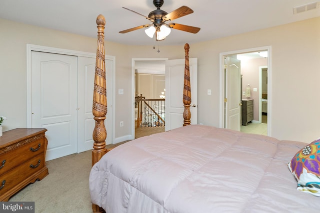 bedroom with ceiling fan, a closet, and light carpet