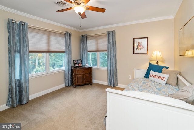 bedroom with crown molding, light carpet, and multiple windows