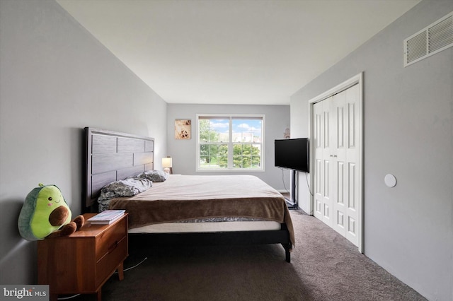 carpeted bedroom featuring a closet