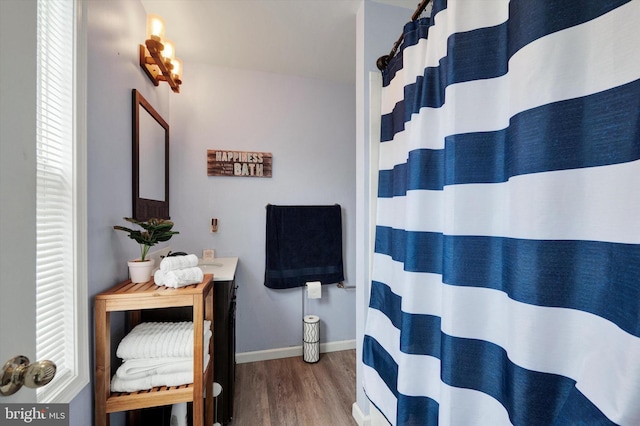 bathroom featuring vanity and hardwood / wood-style floors