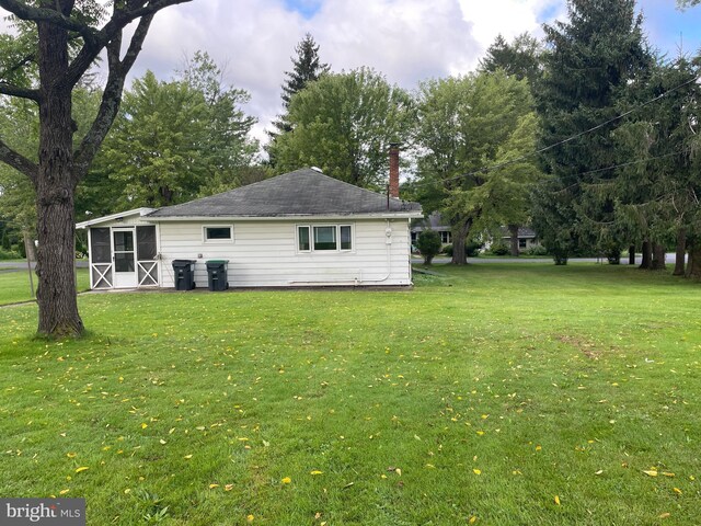 exterior space with a lawn