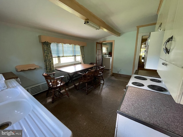 kitchen featuring vaulted ceiling with beams, white cabinetry, washer / clothes dryer, and stove