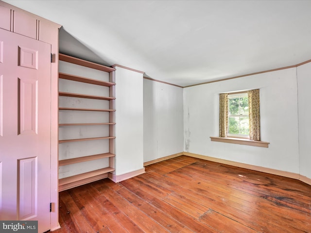 empty room with wood-type flooring