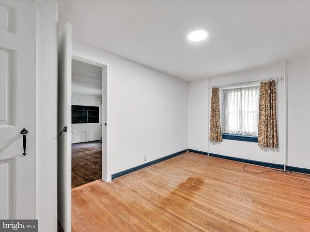 spare room featuring hardwood / wood-style floors