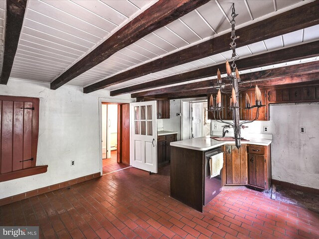 kitchen featuring sink, stainless steel dishwasher, beamed ceiling, and dark brown cabinetry