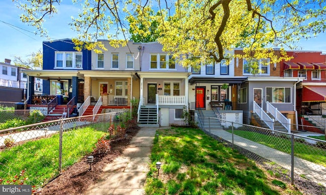 townhome / multi-family property featuring a porch