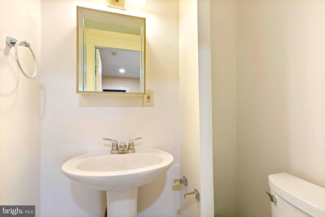 bathroom featuring toilet