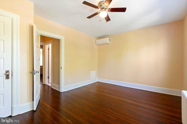 unfurnished room featuring dark hardwood / wood-style flooring, a wall mounted AC, radiator, and ceiling fan