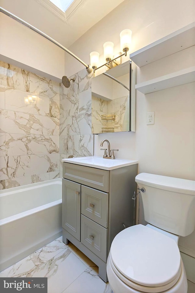 full bathroom featuring tile patterned flooring, toilet, tiled shower / bath combo, and vanity