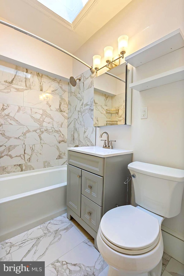 full bathroom featuring tiled shower / bath, a skylight, tile patterned flooring, vanity, and toilet