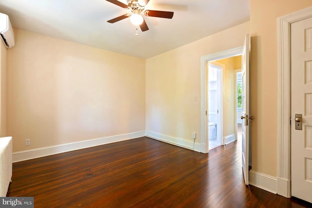 empty room with ceiling fan and dark hardwood / wood-style flooring