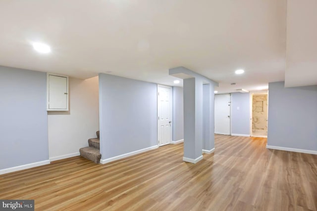 basement with light wood-type flooring