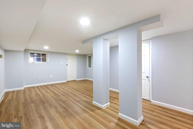 basement featuring light wood-type flooring