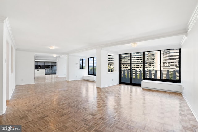 unfurnished living room with parquet floors and ornamental molding