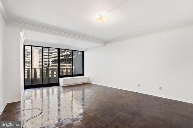 empty room featuring ornamental molding and dark parquet floors