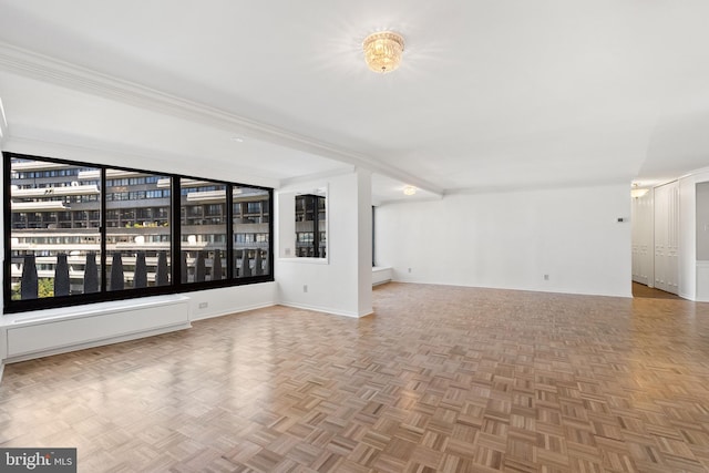 unfurnished living room with parquet floors and crown molding