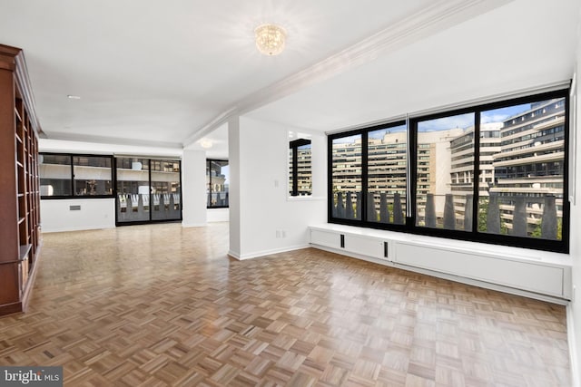 empty room featuring parquet flooring and crown molding